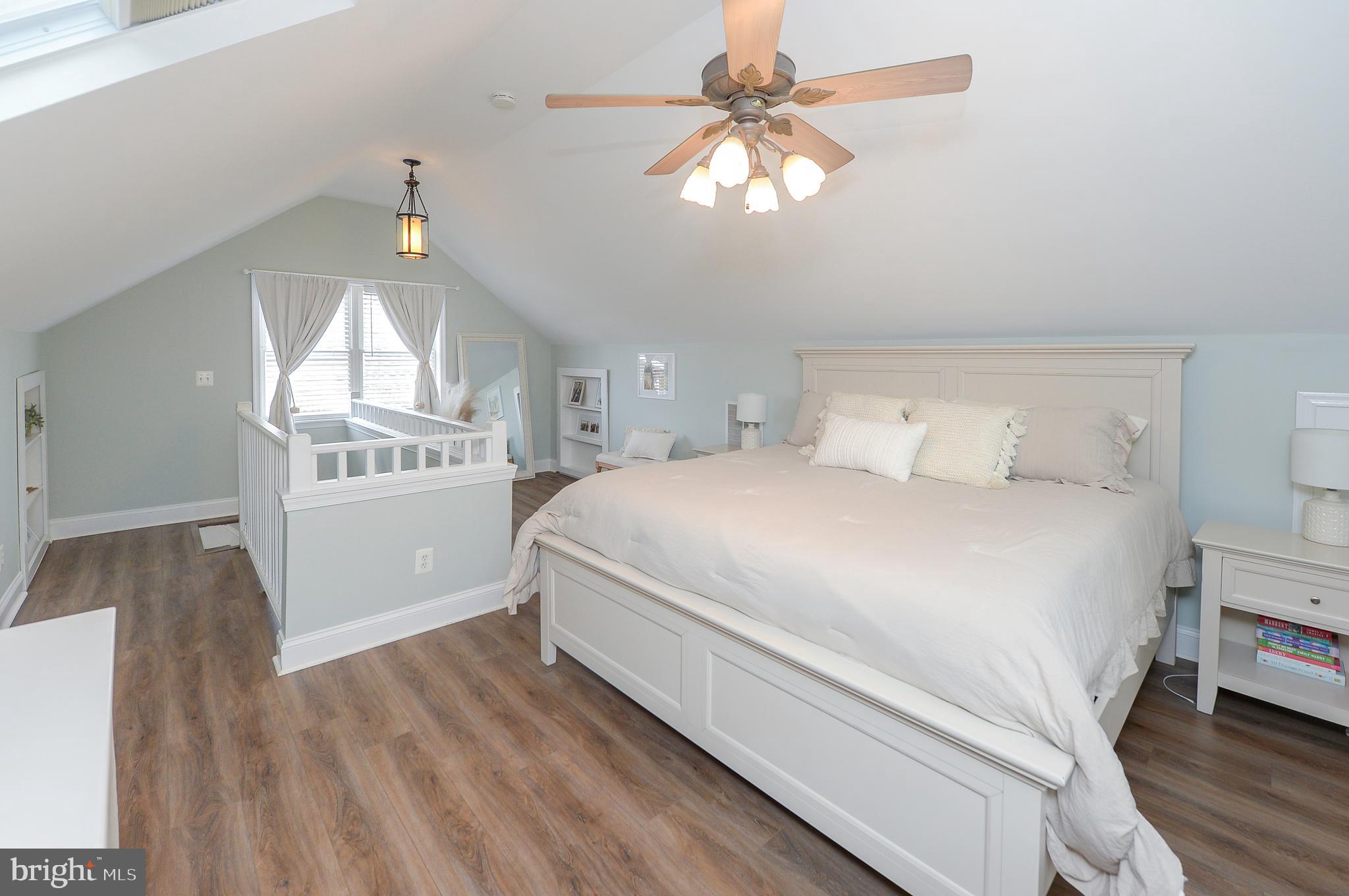 1929 Wayne Avenue Haddon Heights, NJ 08035 - Photo 19 of 36 a bedroom with a bed and a chandelier