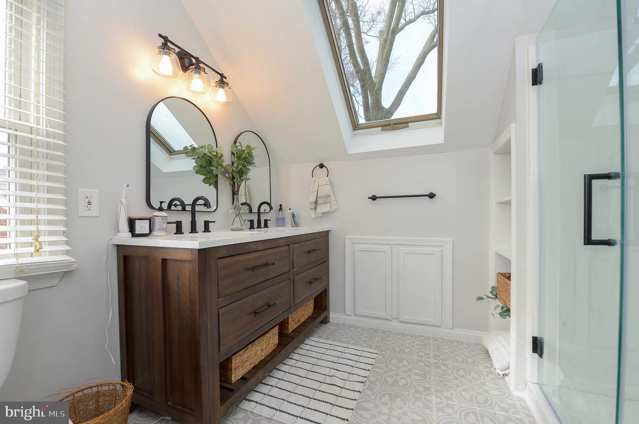 1929 Wayne Avenue Haddon Heights, NJ 08035 - Photo 20 of 36 a bathroom with a double vanity sink and a mirror