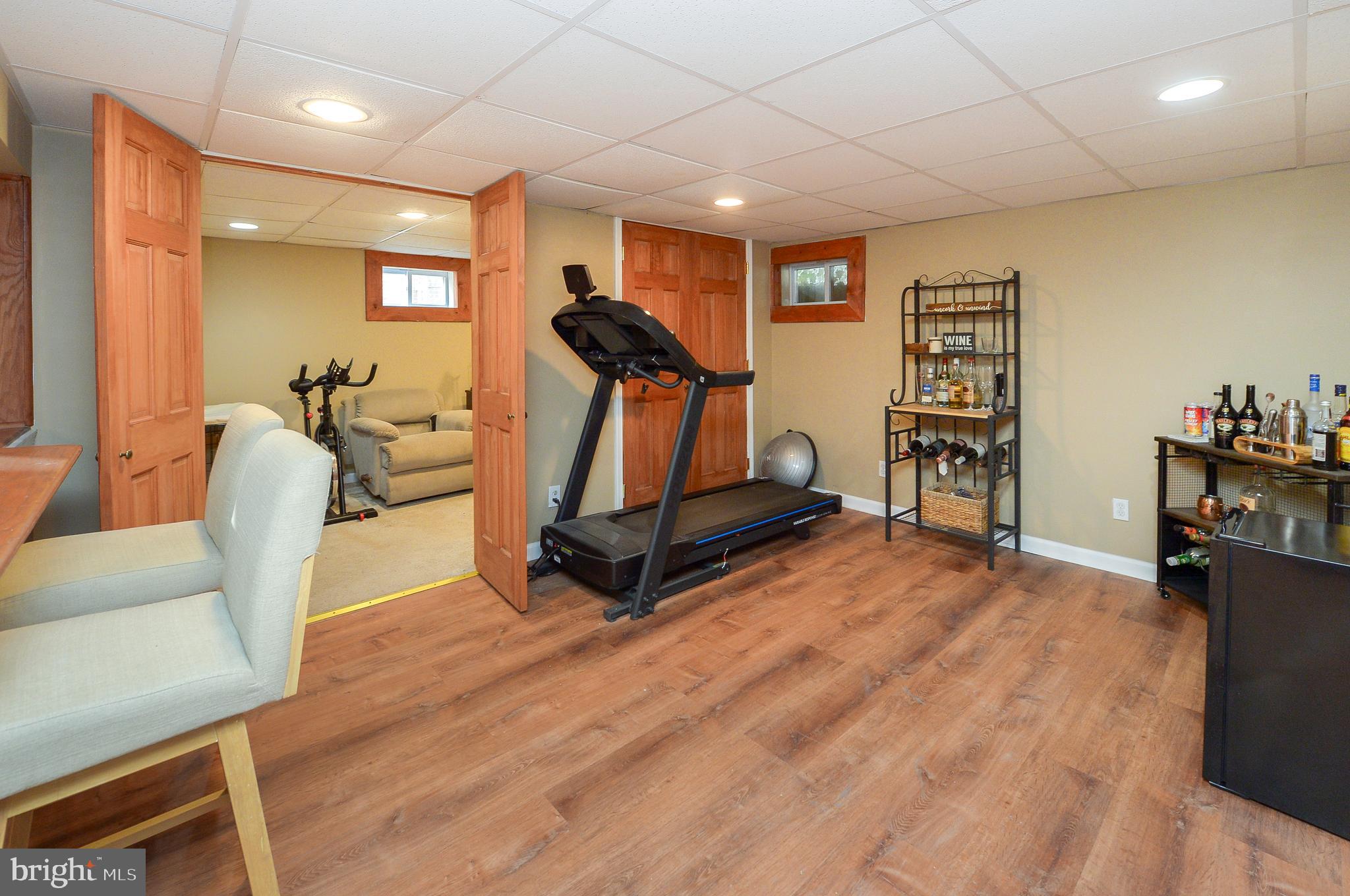 1929 Wayne Avenue Haddon Heights, NJ 08035 - Photo 23 of 36 a room with gym equipment and wooden floor
