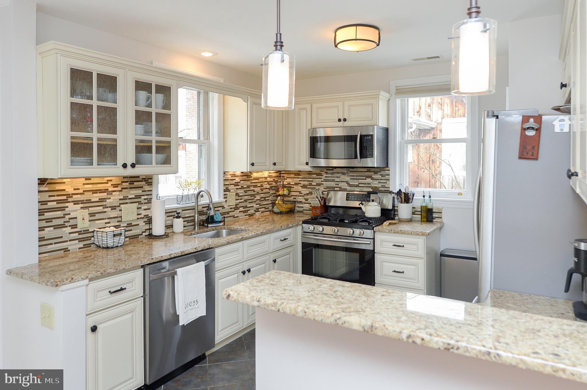 1929 Wayne Avenue Haddon Heights, NJ 08035 - Photo 7 of 36 a kitchen with granite countertop a sink stove and refrigerator