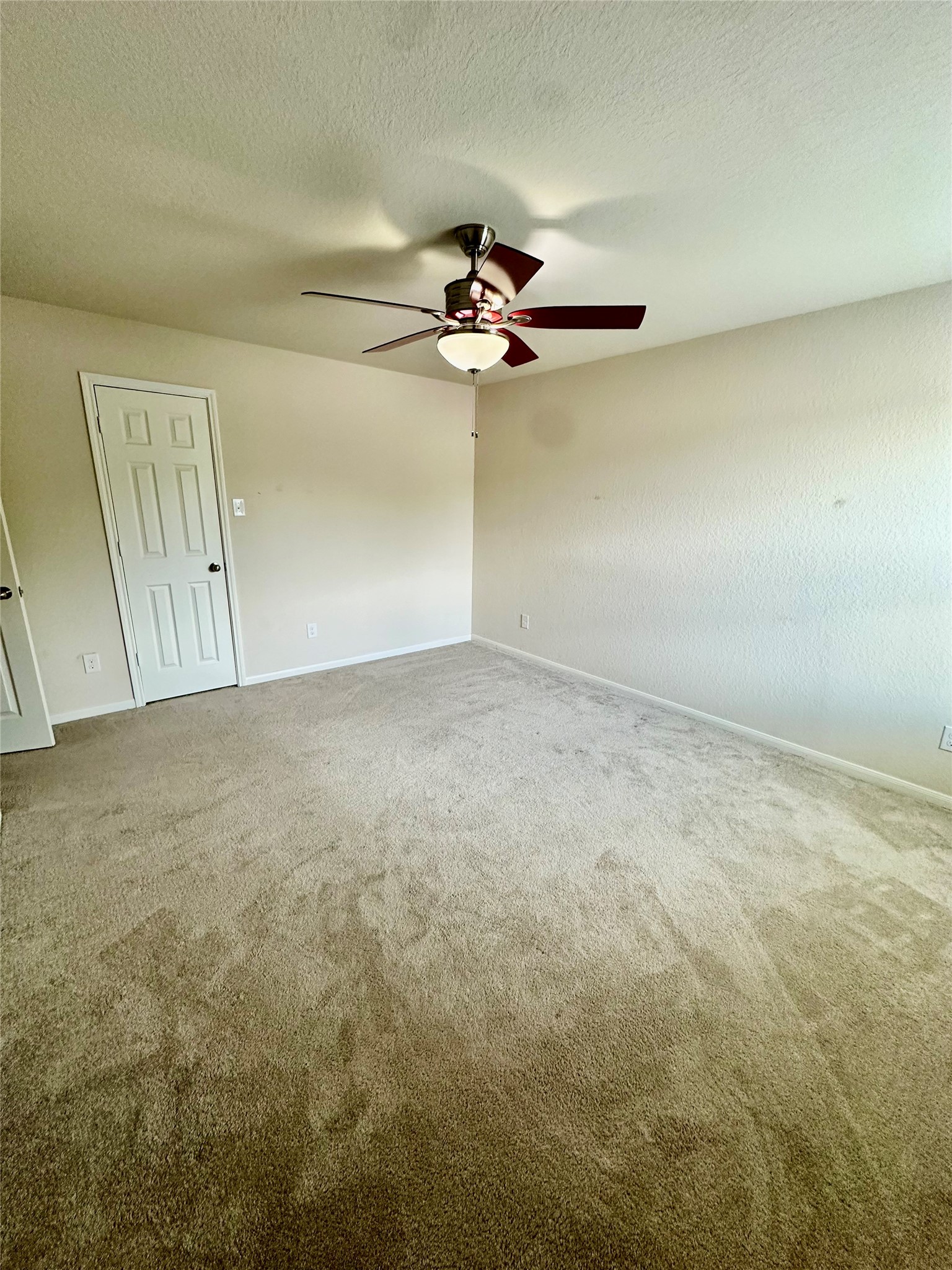 18622 Each Elm Way Houston, TX 77084 - Photo 30 of 35 an empty room with windows and fan