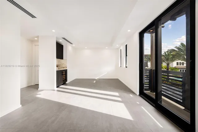a view of a kitchen with an entryway and a fireplace