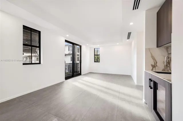 a view of a hallway with wooden shelves