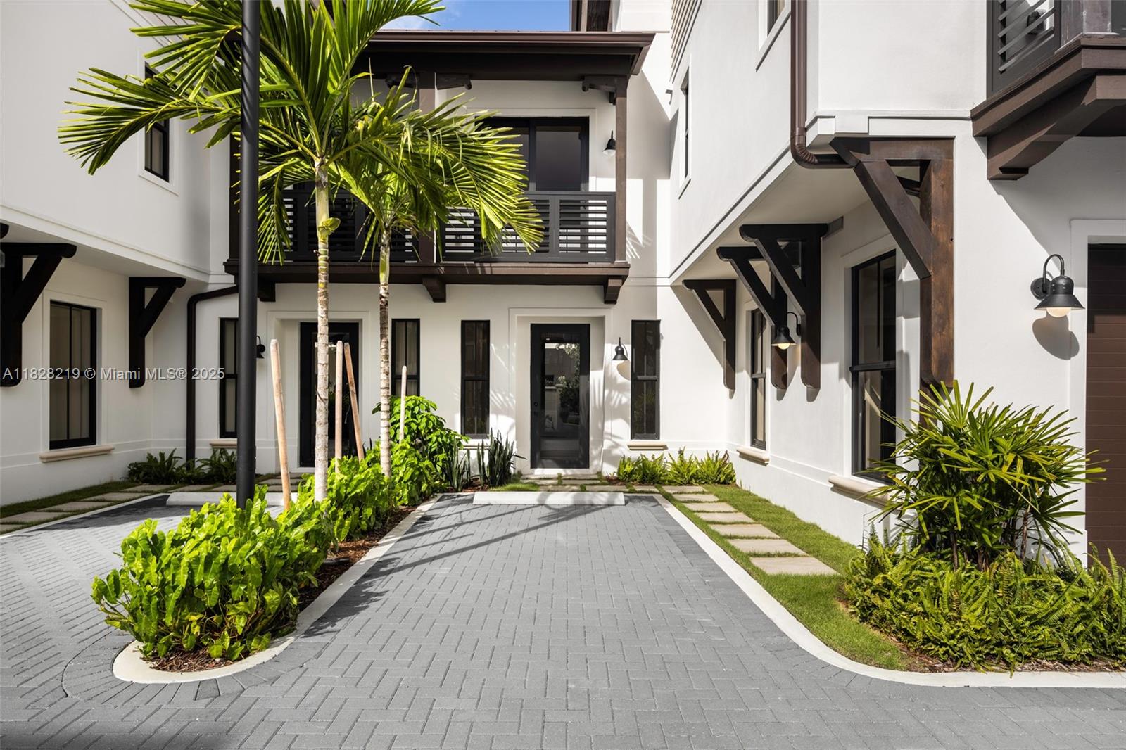 7510 Southwest 100th Street, Unit 12 Pinecrest, FL 33156 - Photo 2 of 36 a front view of a house with a yard