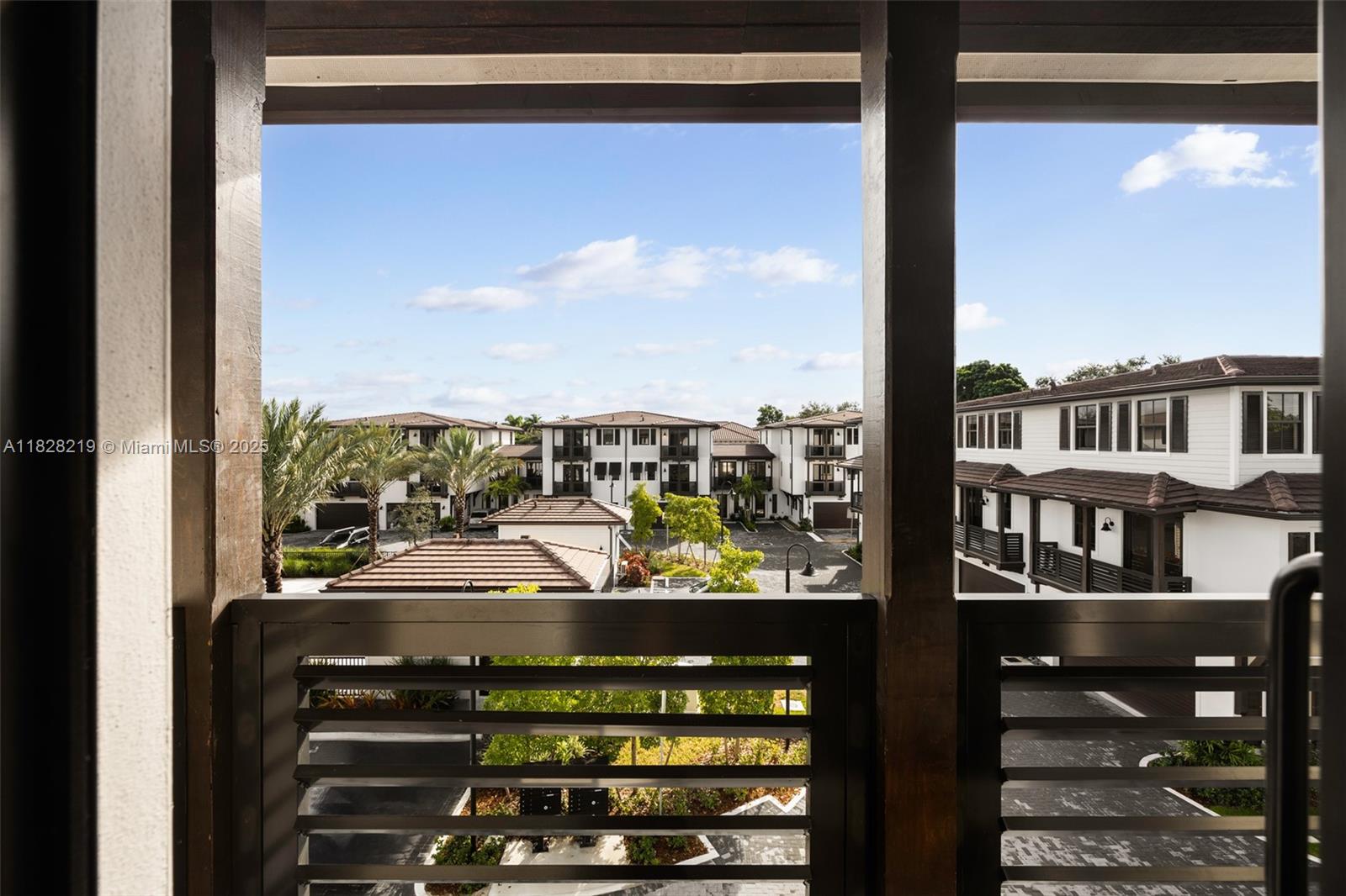 7510 Southwest 100th Street, Unit 12 Pinecrest, FL 33156 - Photo 24 of 36 a view of a balcony with an ocean view