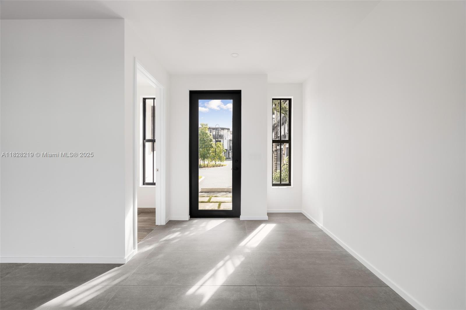 7510 Southwest 100th Street, Unit 12 Pinecrest, FL 33156 - Photo 3 of 36 a view of a room that has a window in it