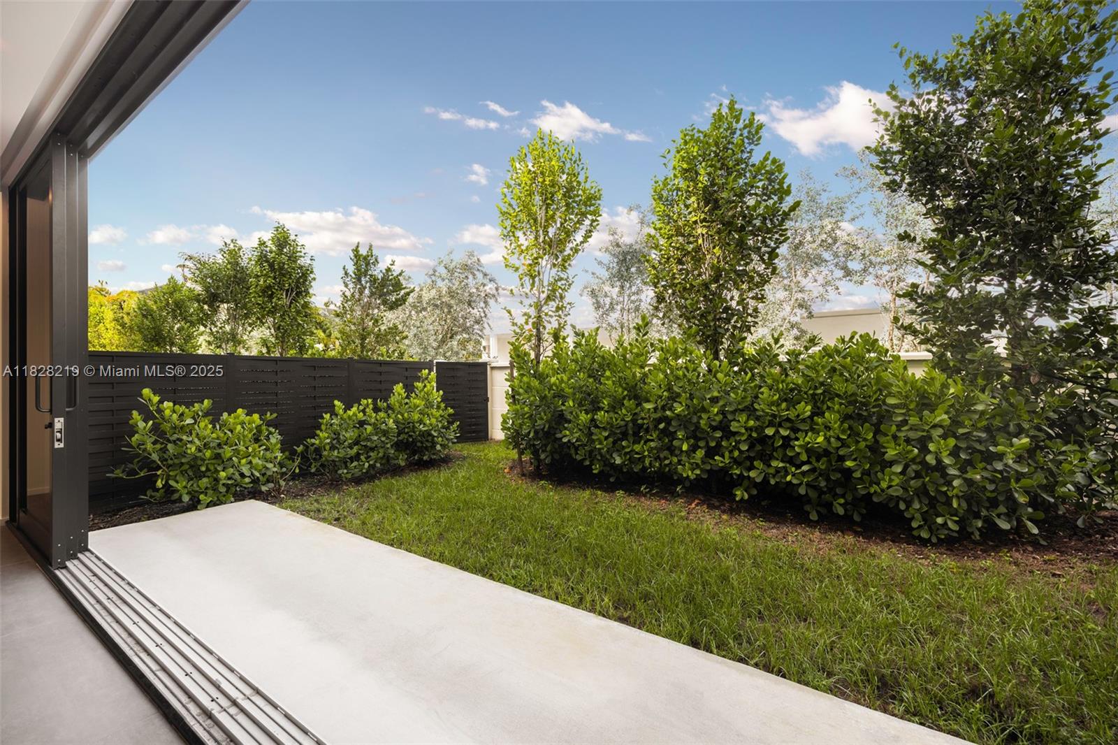 7510 Southwest 100th Street, Unit 12 Pinecrest, FL 33156 - Photo 10 of 36 a view of a yard with potted plants