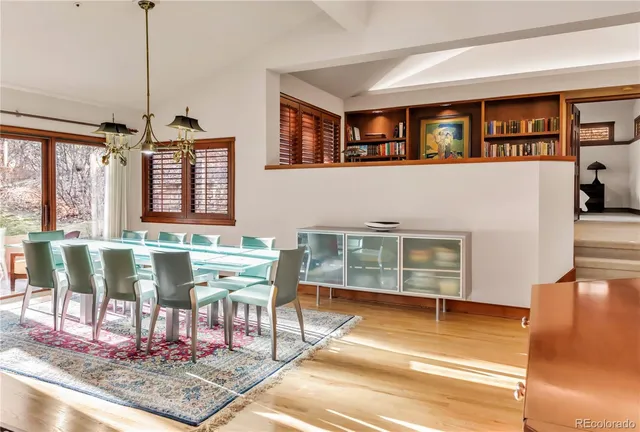 a living room with stainless steel appliances kitchen island granite countertop furniture and a kitchen view