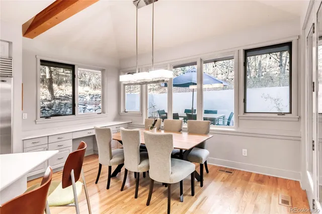 a living room with furniture and a book shelf