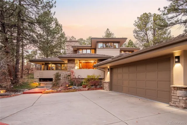 a front view of a house with a garage