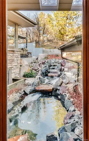 a bedroom with furniture and a flat screen tv