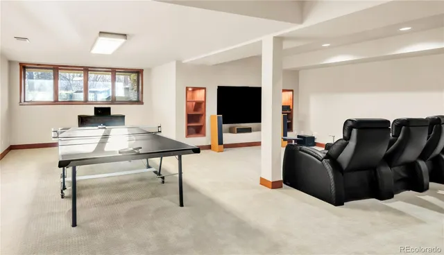 a room with gym equipment and a table