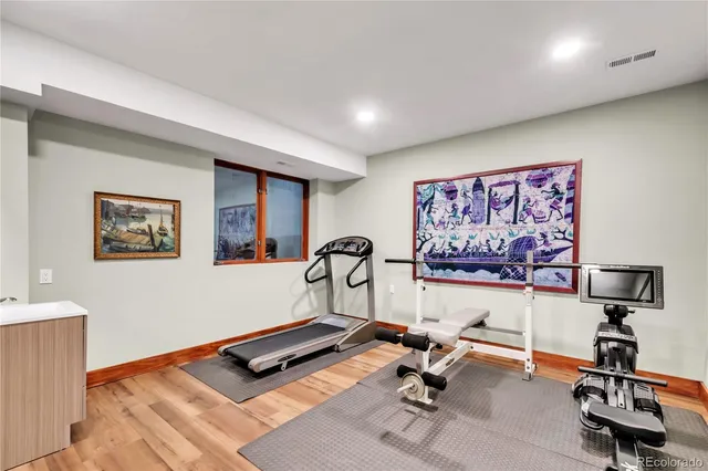 a house that has a tree in front of it