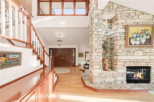 a room with lots of windows and couches