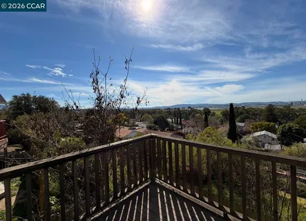 a view of a balcony with city view
