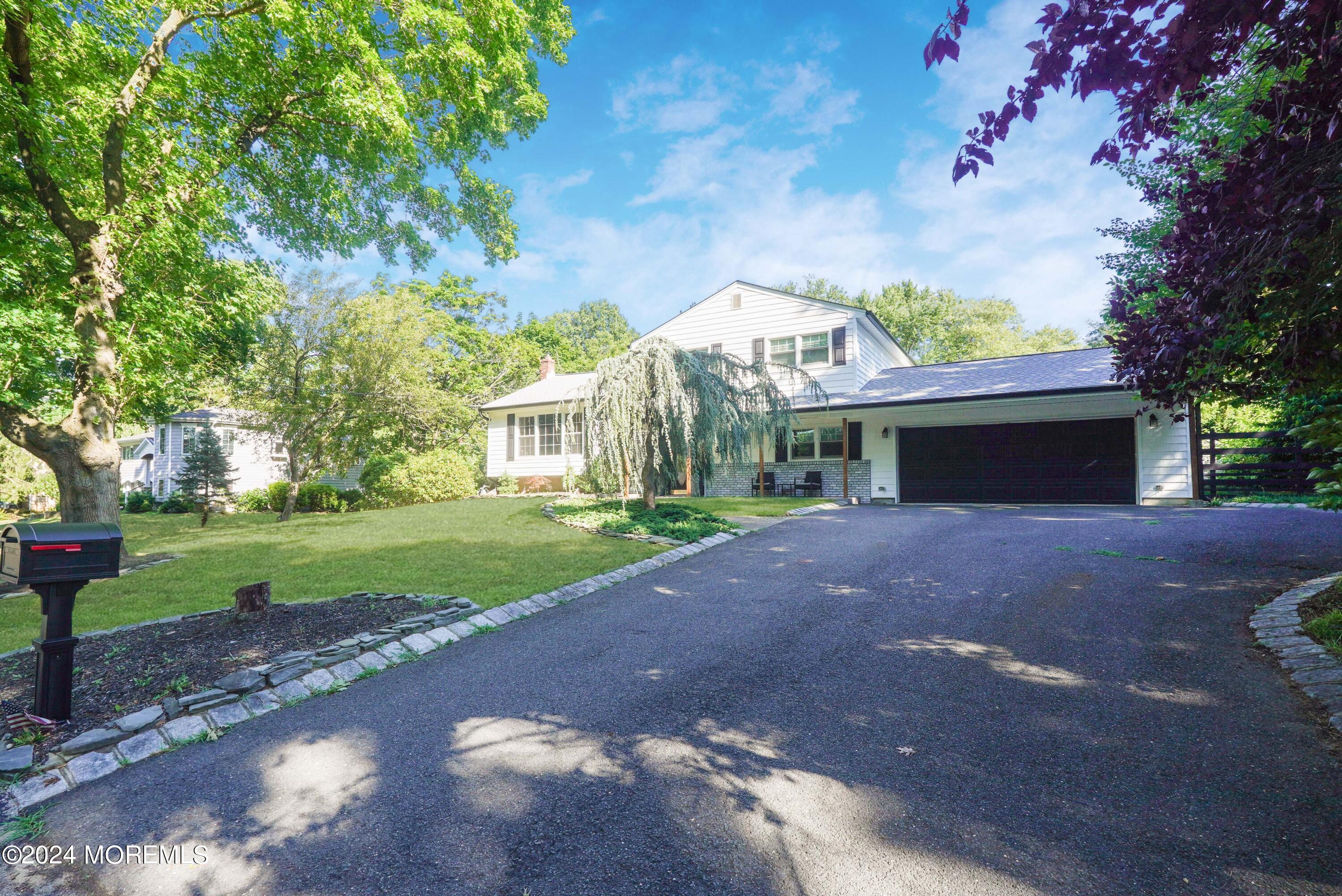 32 Crest Road Middletown, NJ 07748 - Photo 1 of 52 a view of a house with a yard and large tree
