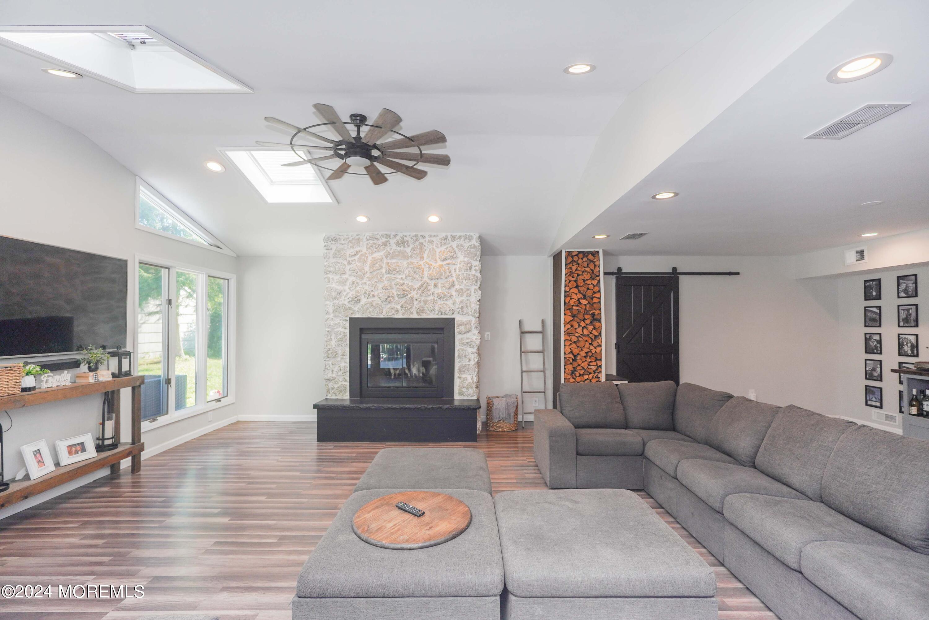 32 Crest Road Middletown, NJ 07748 - Photo 13 of 52 a living room with furniture and a fireplace