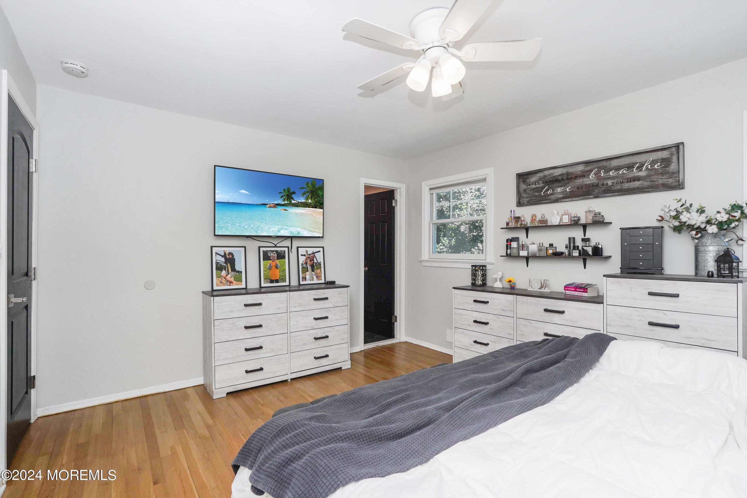32 Crest Road Middletown, NJ 07748 - Photo 39 of 52 a bedroom with a bed and a dresser