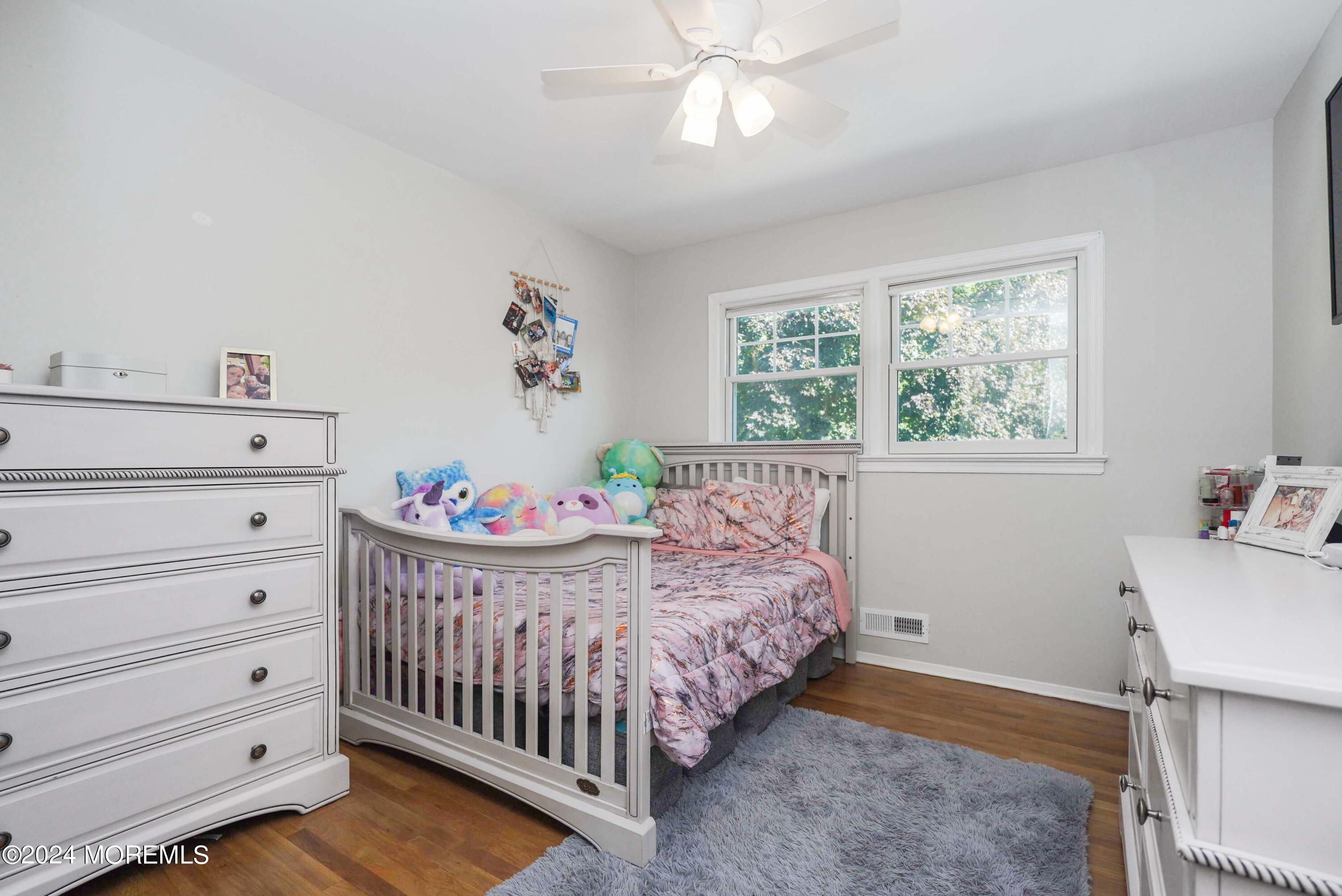 32 Crest Road Middletown, NJ 07748 - Photo 46 of 52 a bedroom with a bed and window