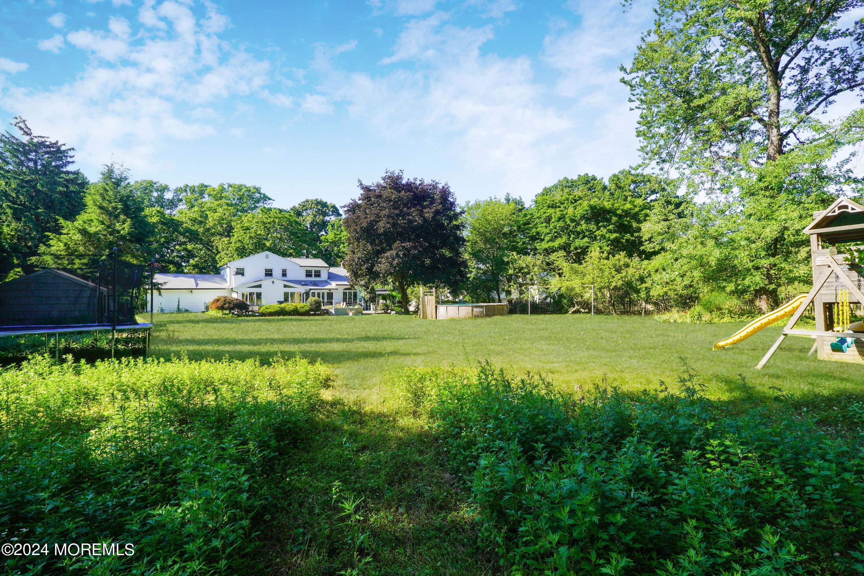 32 Crest Road Middletown, NJ 07748 - Photo 50 of 52 a view of a house with a yard