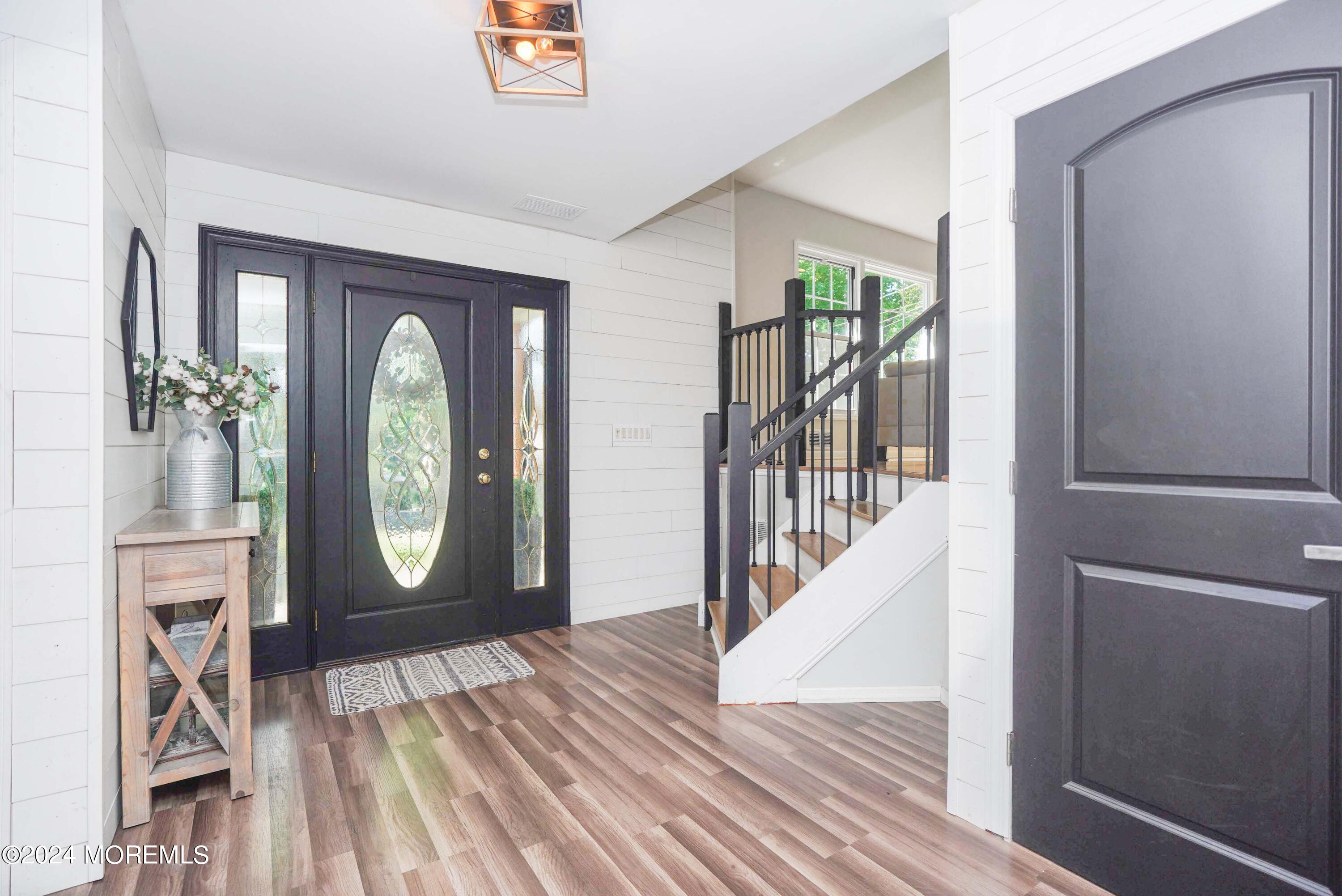 32 Crest Road Middletown, NJ 07748 - Photo 6 of 52 a view of an entryway with wooden floor