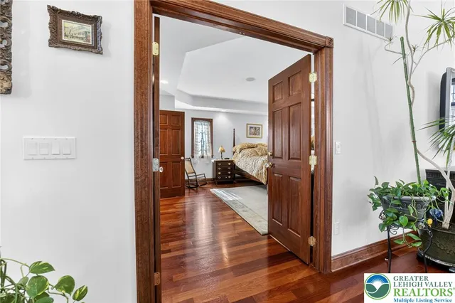 a bed room with a bed and a ceiling fan