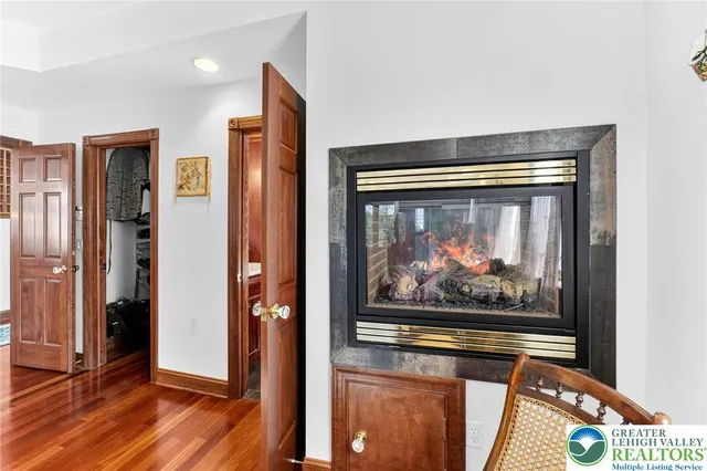 a spacious bathroom with a granite countertop tub sink a mirror and a shower