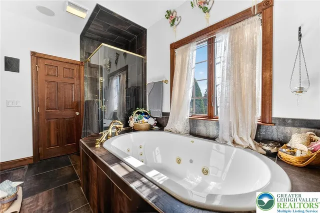 a bedroom with a bed and a potted plant