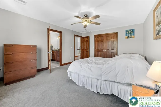a view of a patio with a table and chairs under an umbrella