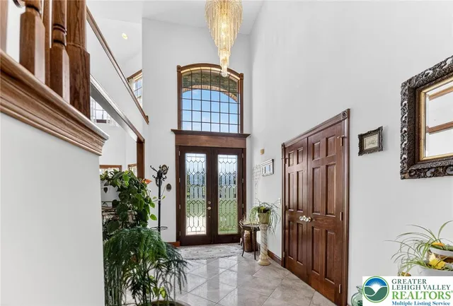 a view of an entryway with wooden floor and door