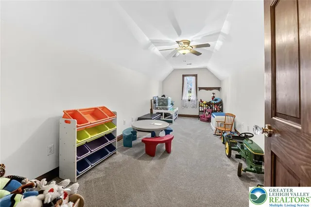 an aerial view of a house with a yard and potted plants