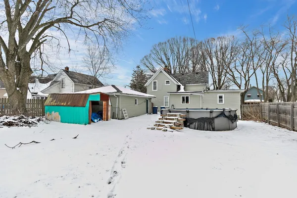 a view of a house with a snow in a yard