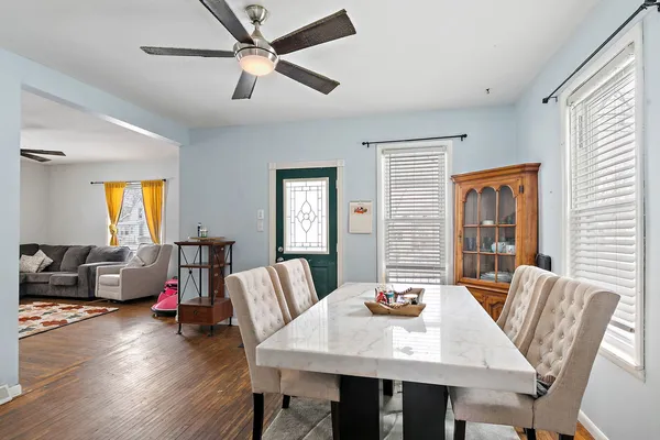 a view of a dining room with furniture window and wooden floor