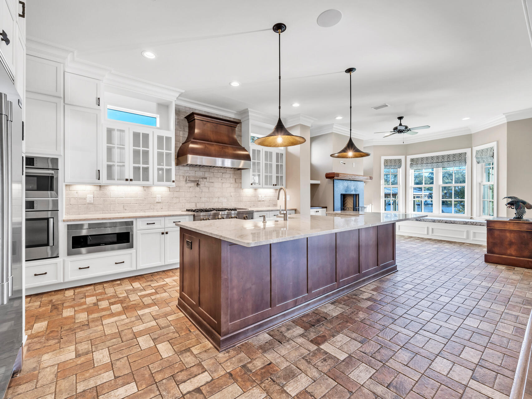 182 Buck Road Santa Rosa Beach, FL 32459 - Photo 25 of 99 a kitchen with stainless steel appliances granite countertop a stove a sink and a wooden floors