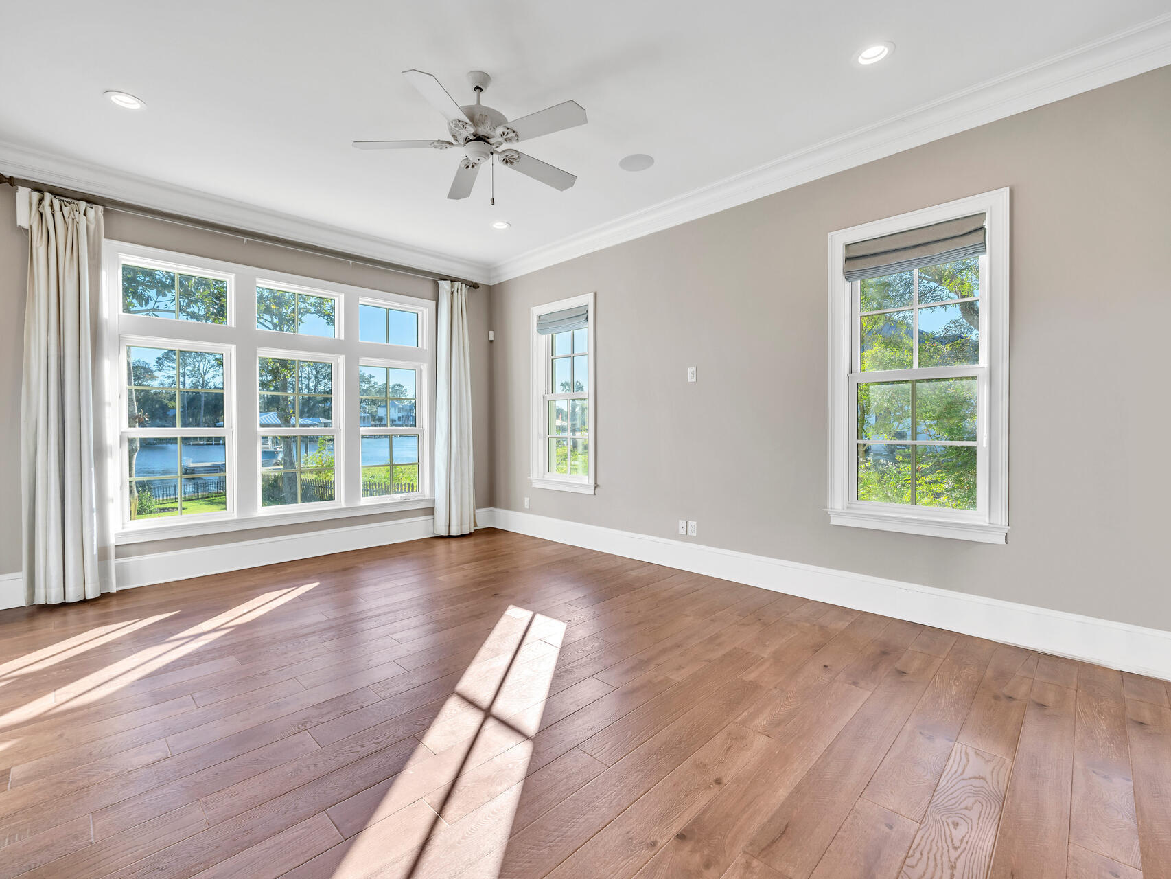 182 Buck Road Santa Rosa Beach, FL 32459 - Photo 36 of 99 a view of an empty room with wooden floor and a window