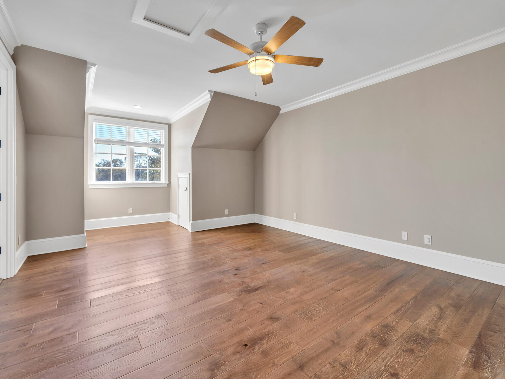 182 Buck Road Santa Rosa Beach, FL 32459 - Photo 46 of 99 an empty room with wooden floor and windows