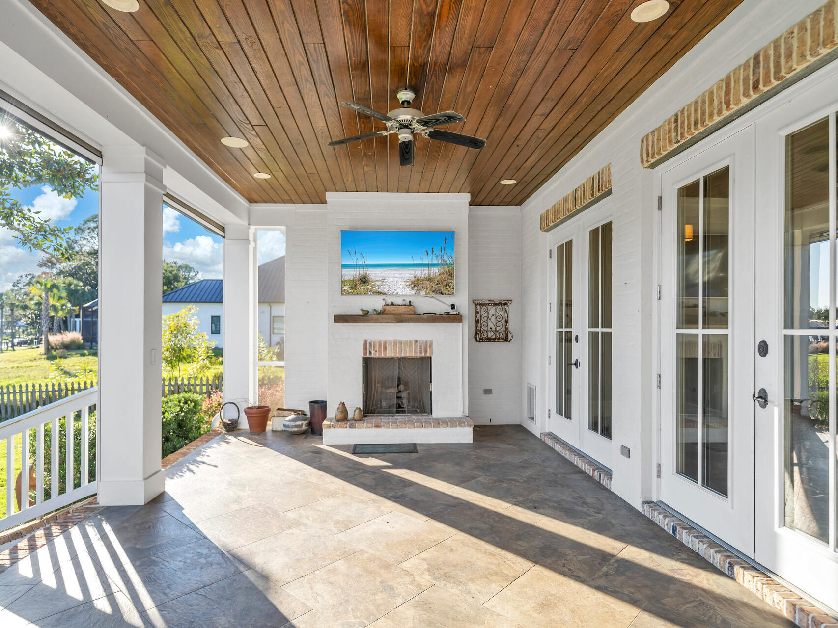182 Buck Road Santa Rosa Beach, FL 32459 - Photo 56 of 99 a view of a hall with wooden floor and a floor to ceiling window