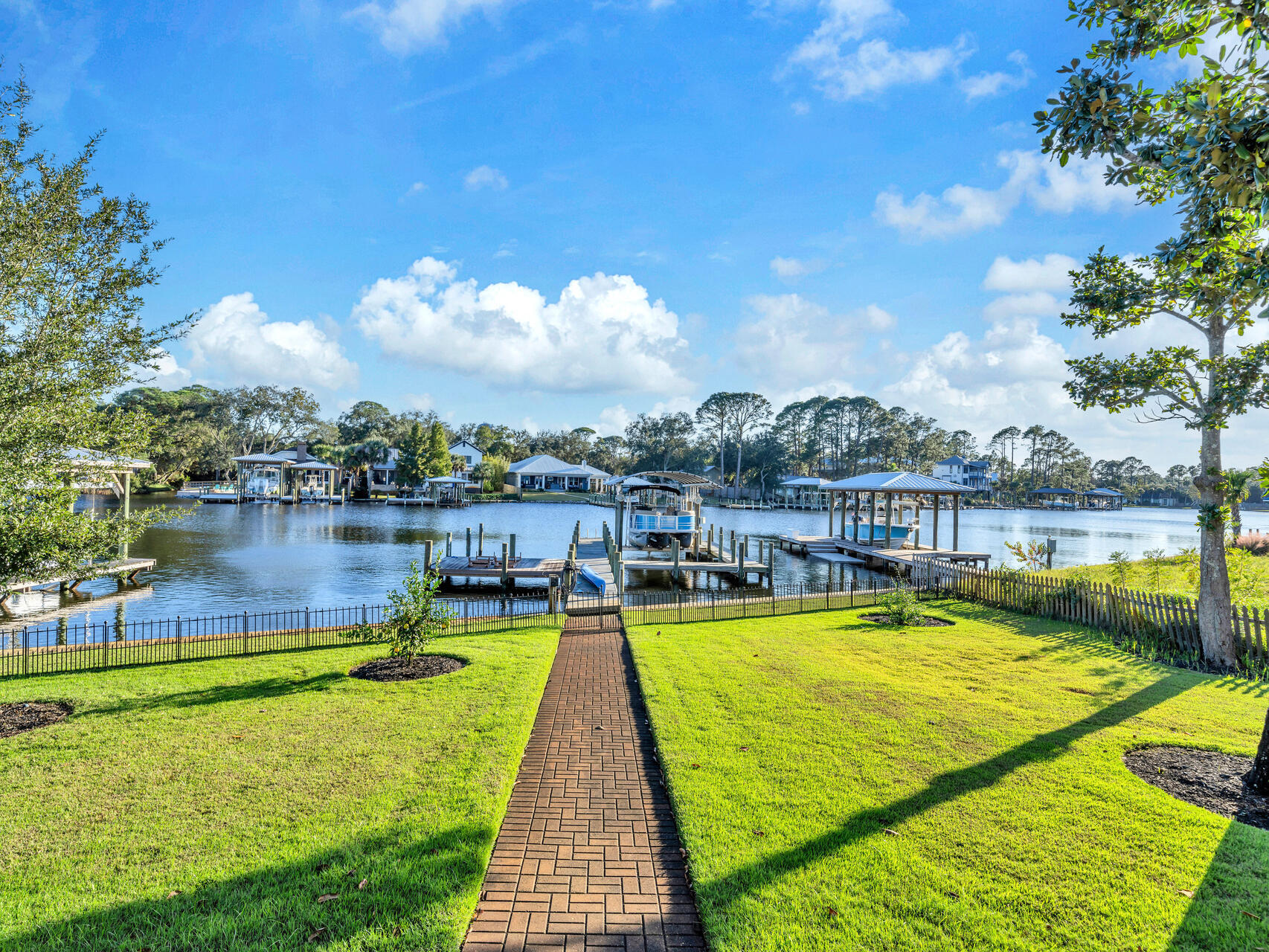 182 Buck Road Santa Rosa Beach, FL 32459 - Photo 67 of 99 a view of a lake with a table and chairs