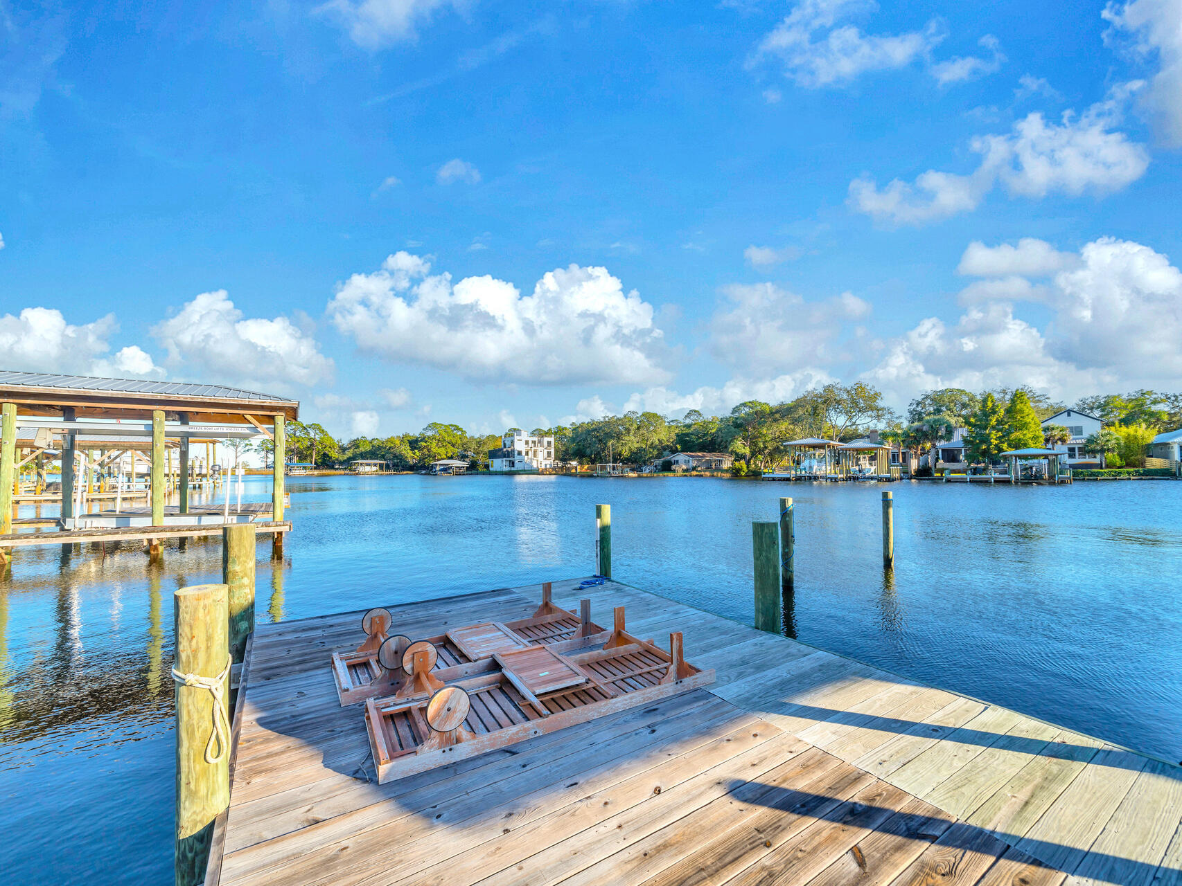 182 Buck Road Santa Rosa Beach, FL 32459 - Photo 77 of 99 a view of a lake with couches chairs