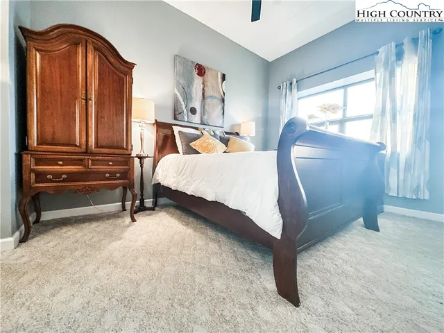 a bed sitting in a room next to a window