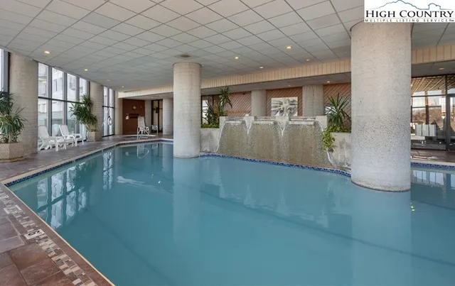 a dining room with furniture and a fireplace