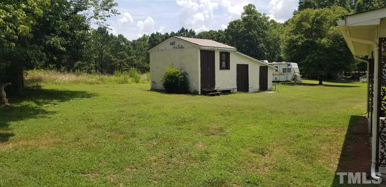 181 Henderson Road Roxboro, NC 27573 - Photo 14 of 14 a view of a back yard of the house