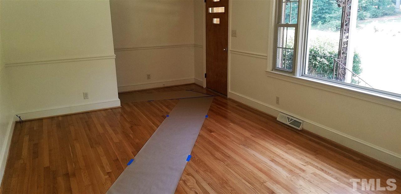 181 Henderson Road Roxboro, NC 27573 - Photo 7 of 14 a view of a room with wooden floor and windows