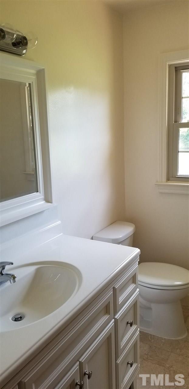 181 Henderson Road Roxboro, NC 27573 - Photo 10 of 14 a bathroom with a sink and a toilet