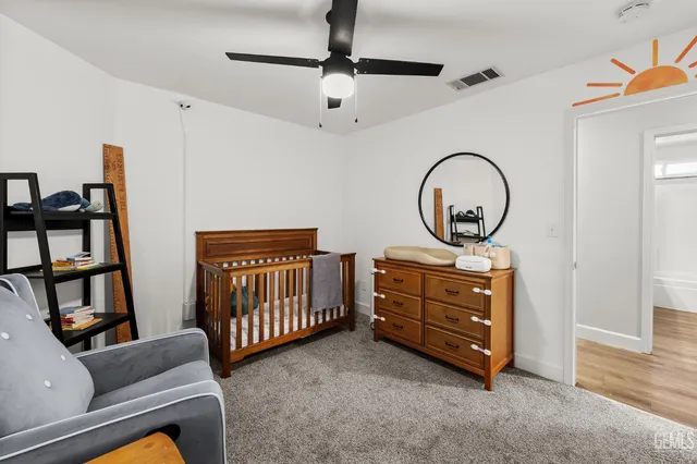 a room with furniture and a baby crib