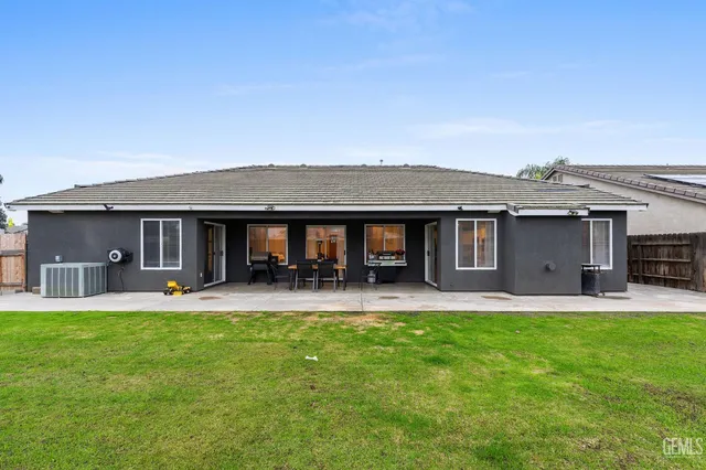 a front view of a house with a yard and porch