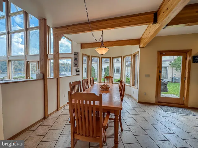 a dining room with furniture and window