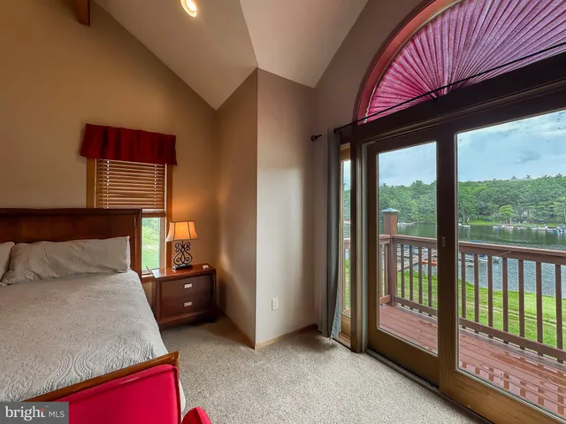 a bed room with a bed and a television