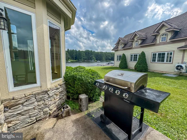 a view of a swimming pool and lounge chair
