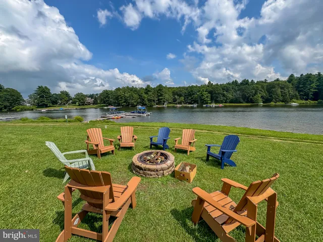 an outdoor space with furniture and city view
